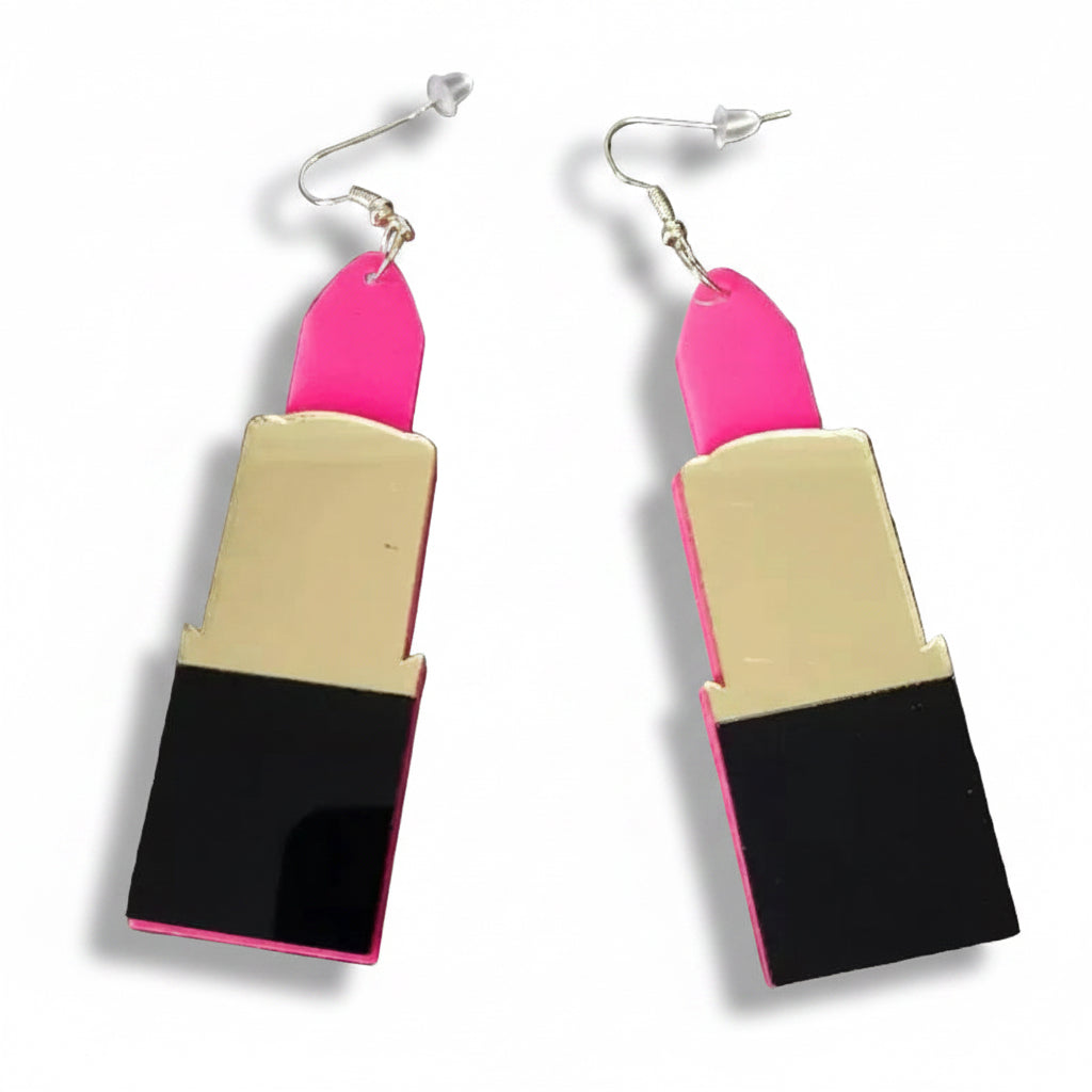 Lipstick-shaped earrings with pink caps in a gold and black tube.
